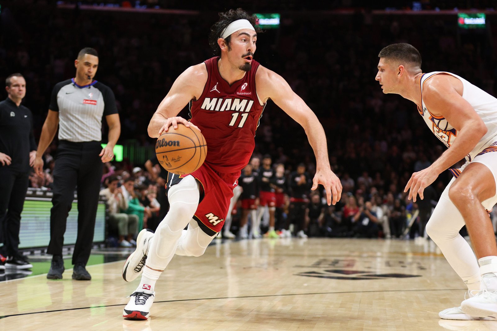 MIAMI, FLORIDA - JANUARY 13: Jaime Jaquez Jr. #11 of the Miami Heat drive the ball during the second half against the Phoenix Suns at Kaseya Center on January 13, 2026 in Miami, Florida. NOTE TO USER: User expressly acknowledges and agrees that, by downloading and or using this photograph, User is consenting to the terms and conditions of the Getty Images License Agreement. (Photo by Tomas Diniz Santos/Getty Images)